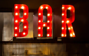 Red illuminated BAR channel letters